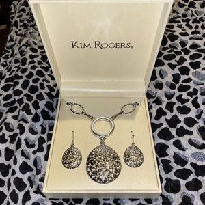 Silver necklace set with matching earrings.